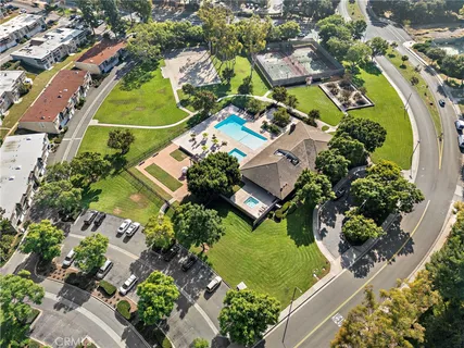 an aerial view of a house with a swimming pool