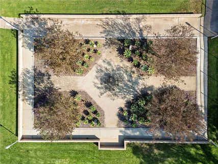 a view of swimming pool with a patio and a yard
