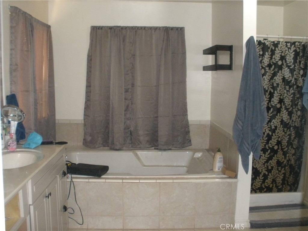 39036 Sage Road Lucerne Valley, CA 92356 - Photo 14 of 41 a bathroom with a bathtub and shower