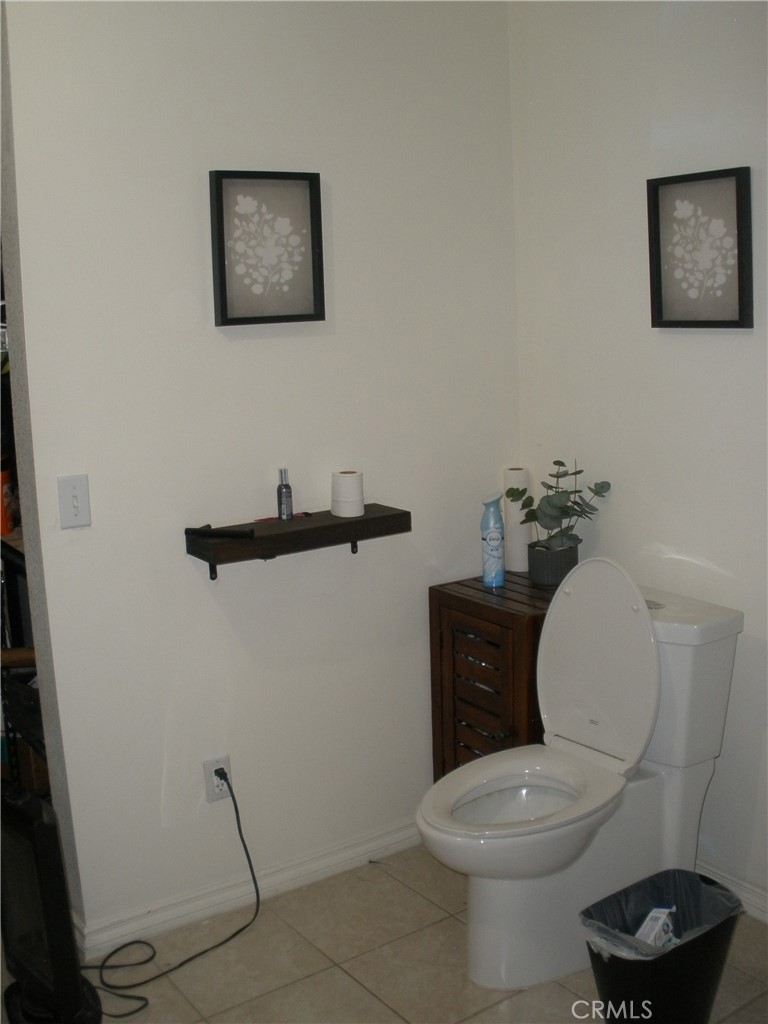 39036 Sage Road Lucerne Valley, CA 92356 - Photo 15 of 41 a white toilet sitting next to a bathroom sink