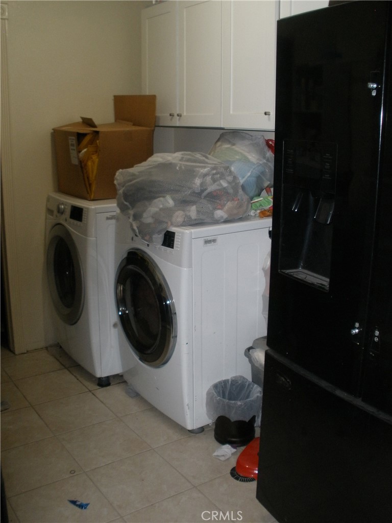 39036 Sage Road Lucerne Valley, CA 92356 - Photo 16 of 41 a utility room with dryer and washer