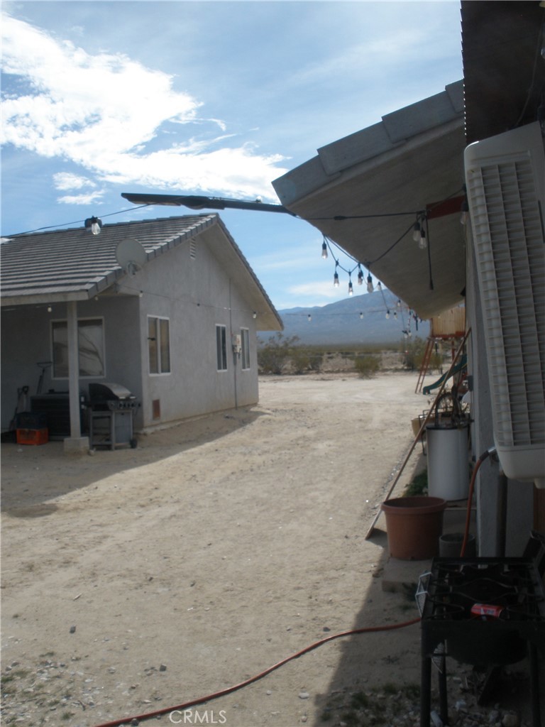 39036 Sage Road Lucerne Valley, CA 92356 - Photo 19 of 41 a view of a house with a backyard