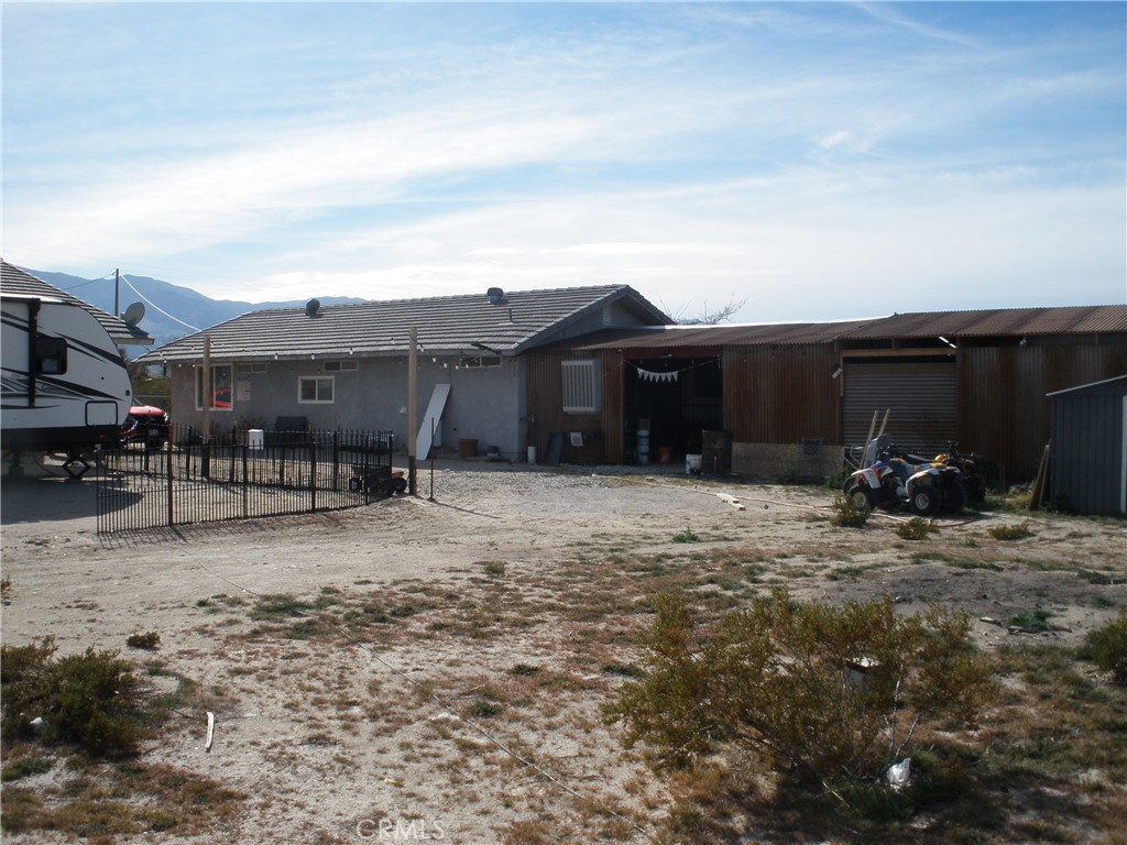 39036 Sage Road Lucerne Valley, CA 92356 - Photo 20 of 41 a view of a house with a yard and pathway