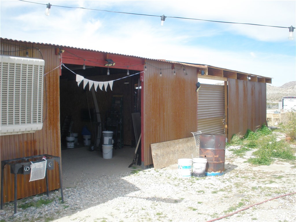 39036 Sage Road Lucerne Valley, CA 92356 - Photo 21 of 41 a view of a chairs in front of house