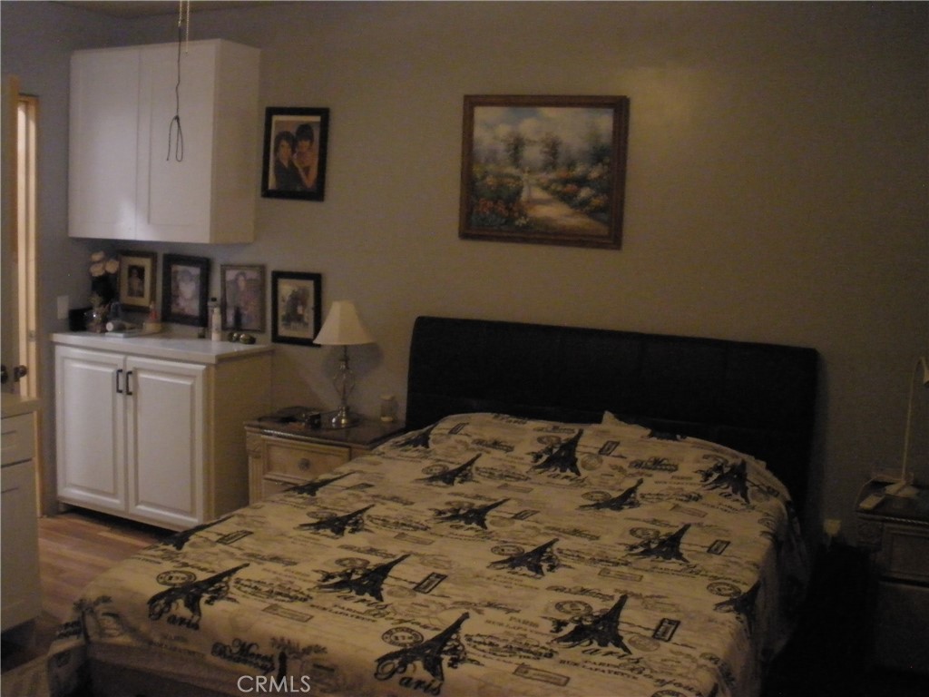 39036 Sage Road Lucerne Valley, CA 92356 - Photo 31 of 41 a bed sitting in a bedroom next to a window