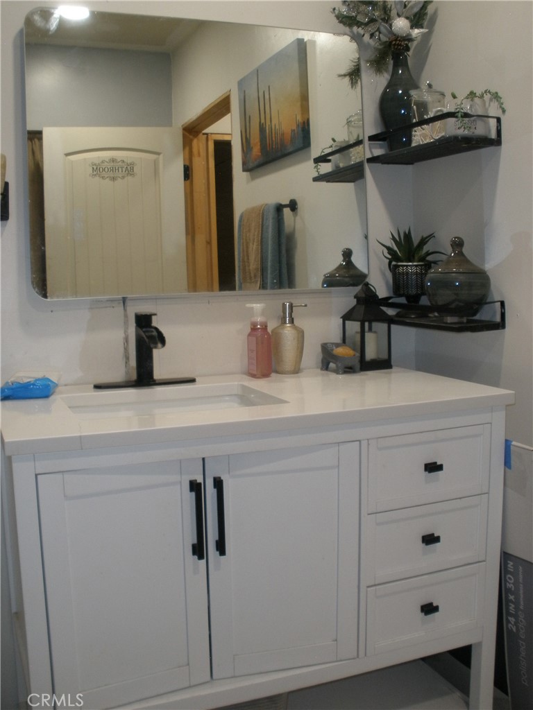 39036 Sage Road Lucerne Valley, CA 92356 - Photo 32 of 41 a bathroom with a sink and a mirror