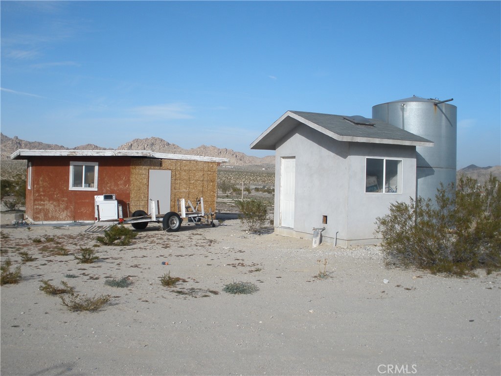39036 Sage Road Lucerne Valley, CA 92356 - Photo 36 of 41 a front view of a house with a yard