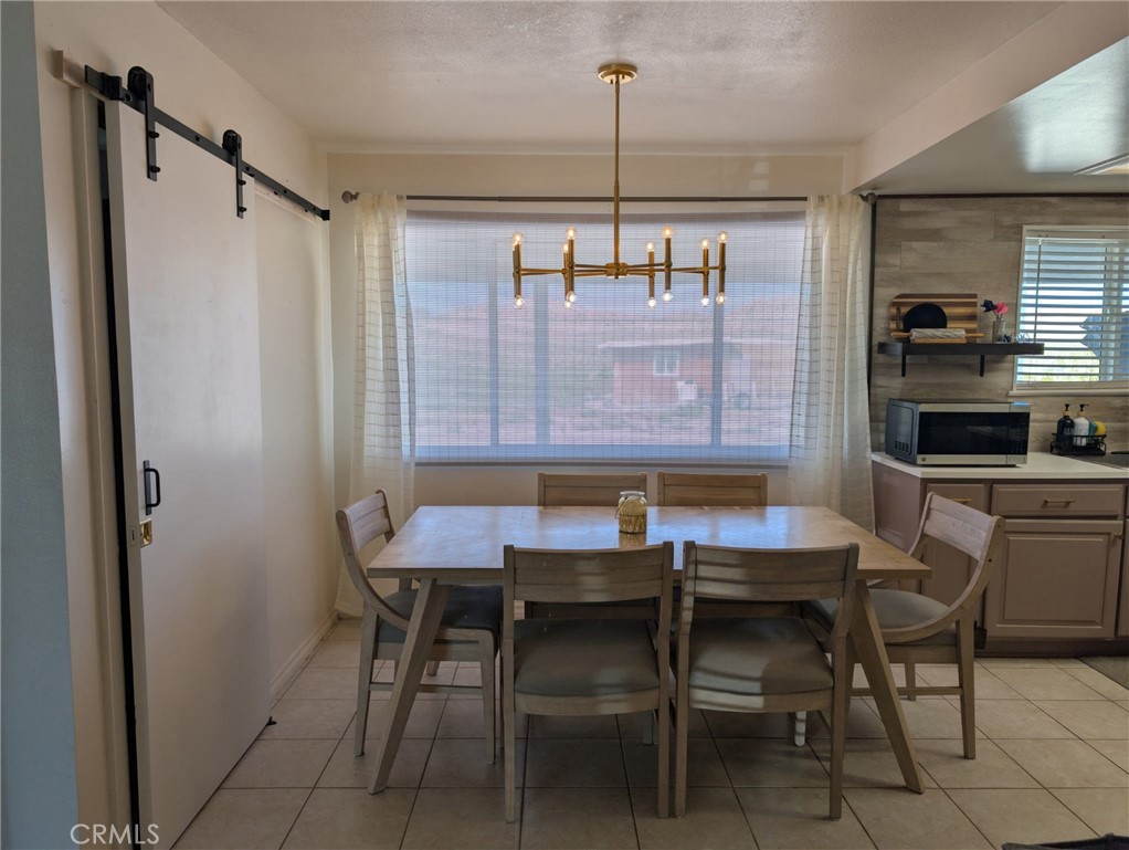 39036 Sage Road Lucerne Valley, CA 92356 - Photo 7 of 41 a dining room with a table and chairs