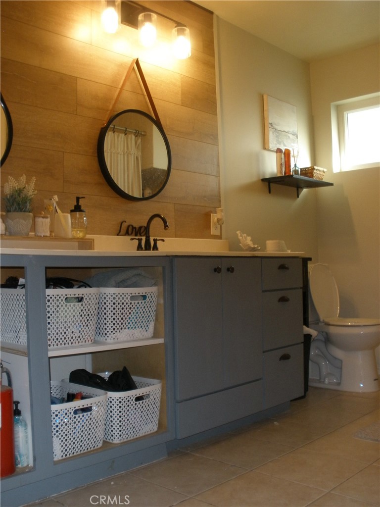 39036 Sage Road Lucerne Valley, CA 92356 - Photo 10 of 41 a bathroom with a sink a toilet and a mirror