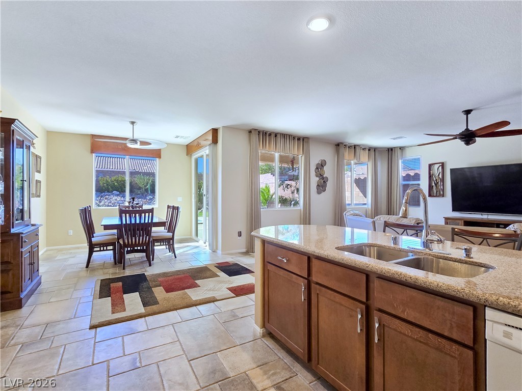 2485 Morrow Ridge Place Laughlin, NV 89029 - Photo 39 of 40 An open floorplan seamlessly connects the well-lit kitchen, dining area, and living space.