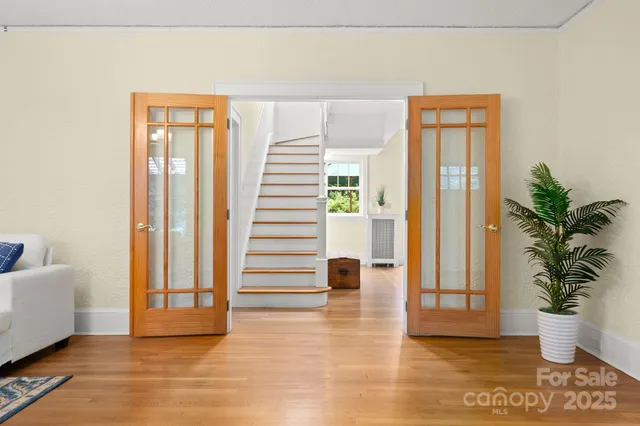 a view of entryway with wooden floor and glass door