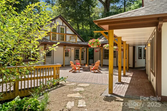 a view of a chair and tables in the balcony