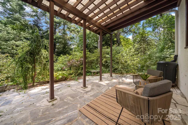 a view of a couches chair and wooden floor