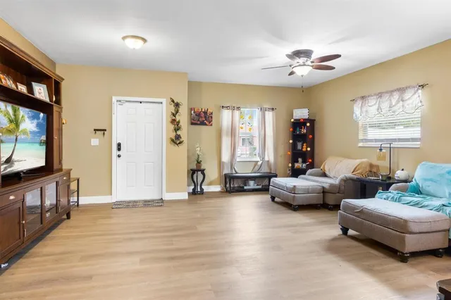 a living room with furniture and a flat screen tv