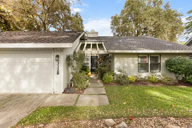 a front view of a house with a yard