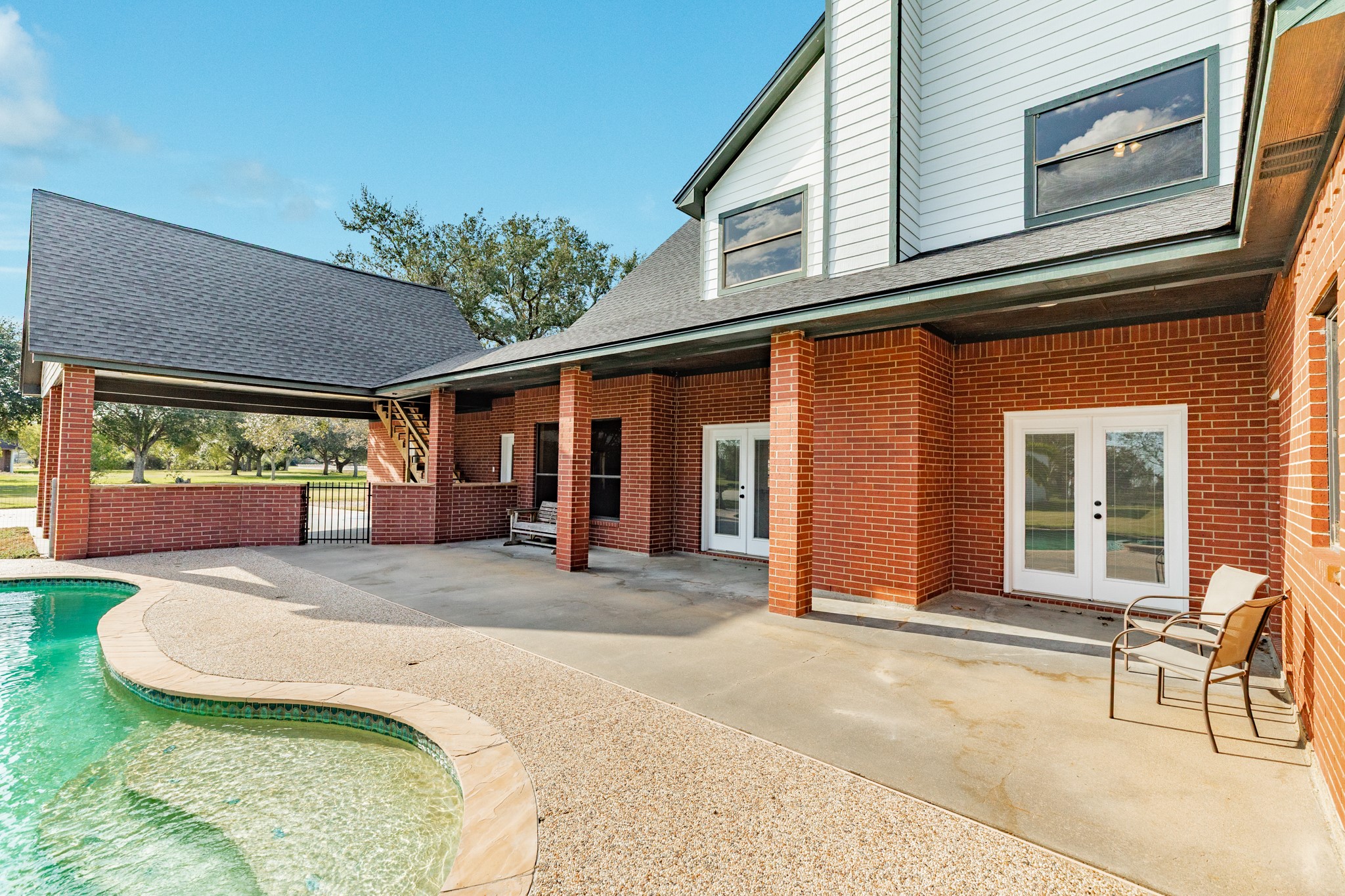 310 County Road 47 Angleton, TX 77515 - Photo 17 of 50 a view of a house with a patio