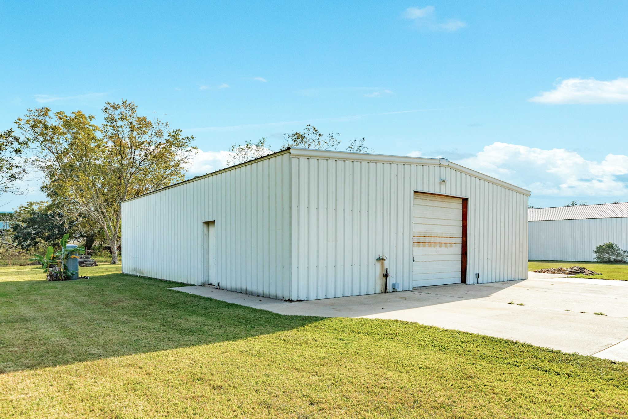 310 County Road 47 Angleton, TX 77515 - Photo 19 of 50 a view of a backyard with garage