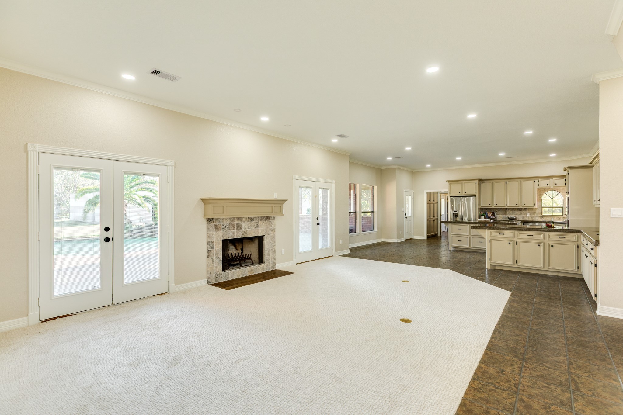310 County Road 47 Angleton, TX 77515 - Photo 23 of 50 a large white kitchen with a white stove top oven and fireplace