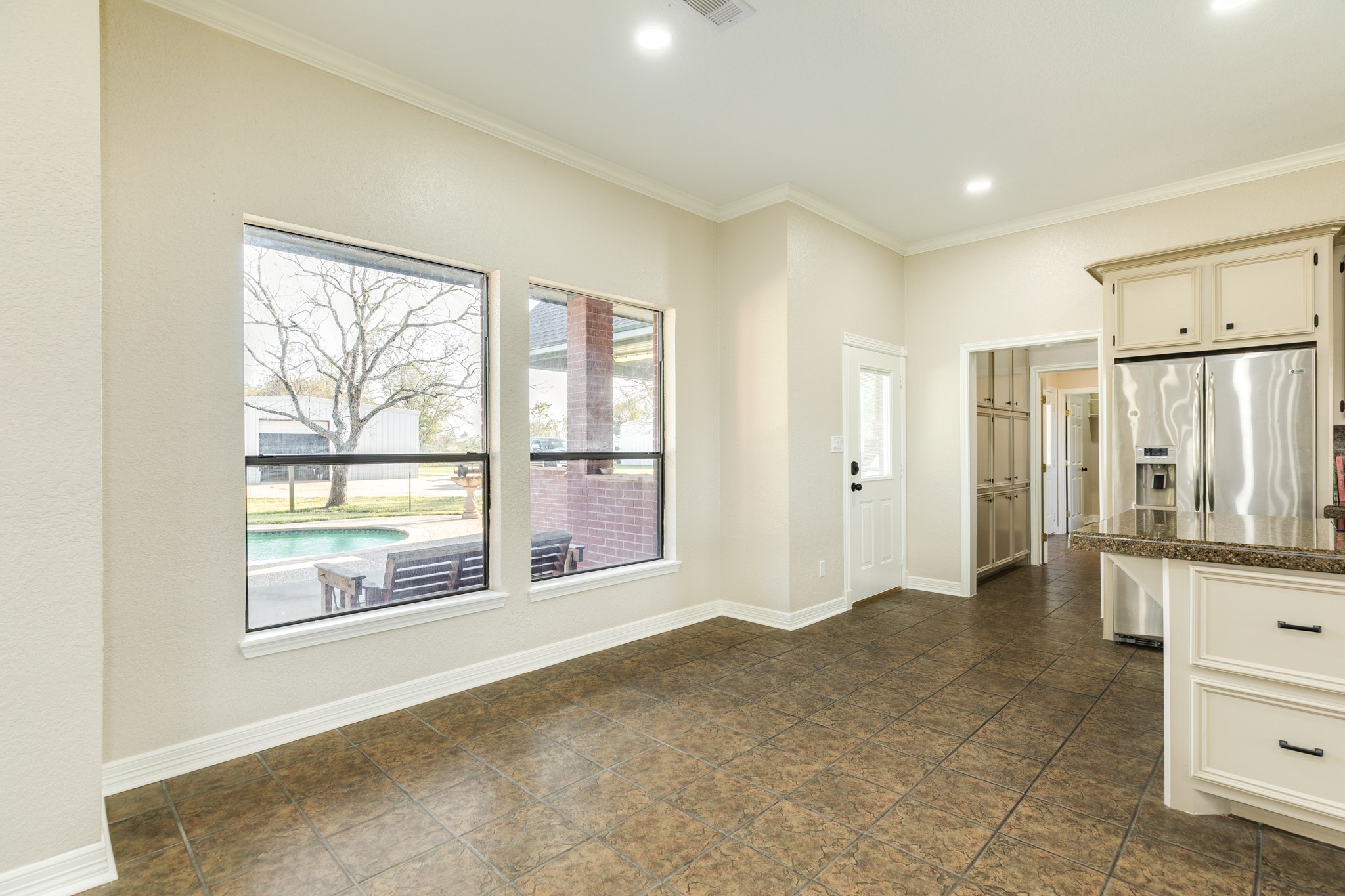 310 County Road 47 Angleton, TX 77515 - Photo 31 of 50 a view of an empty room with a window