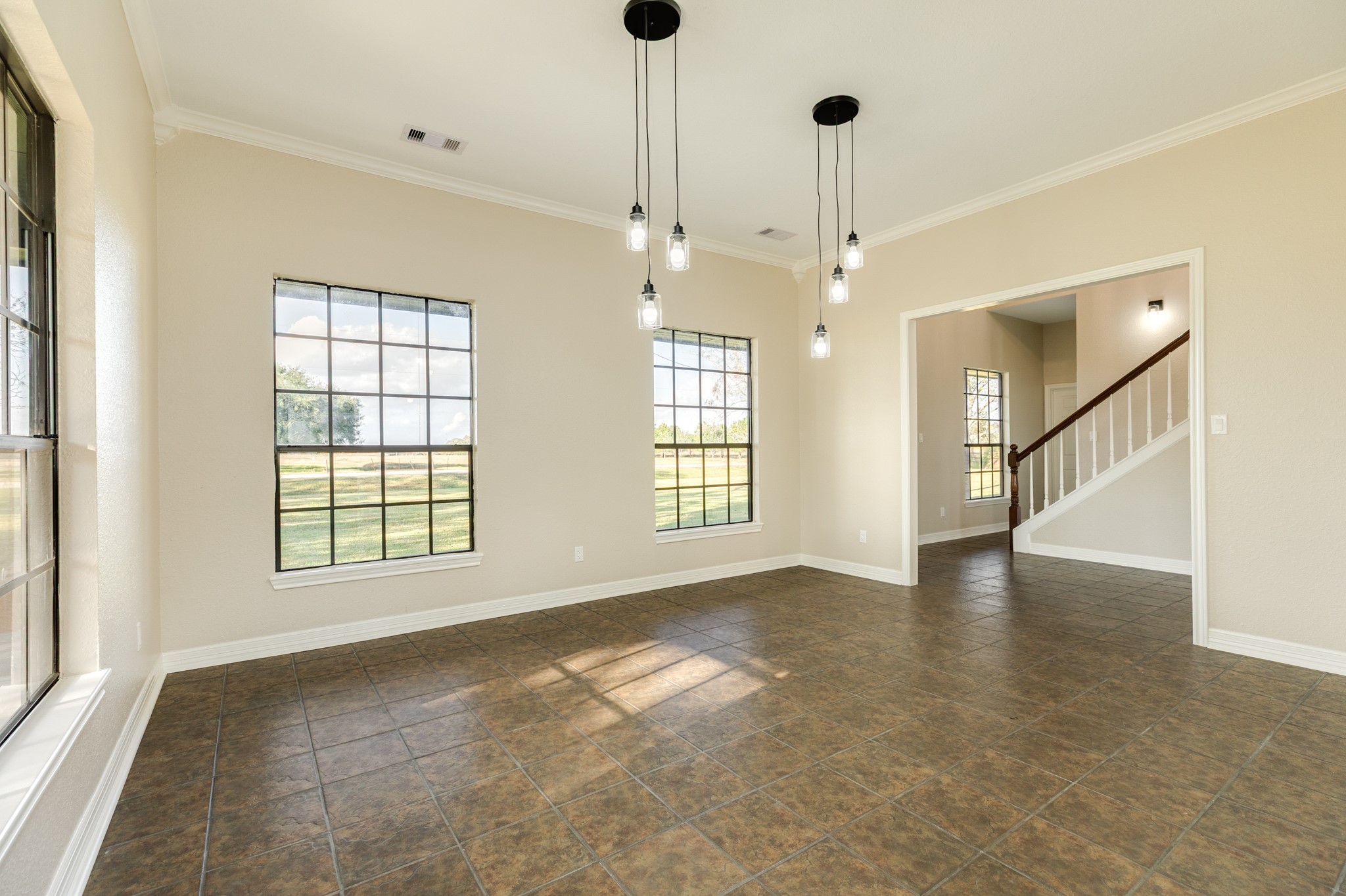 310 County Road 47 Angleton, TX 77515 - Photo 32 of 50 a view of an empty room with a window and wooden floor