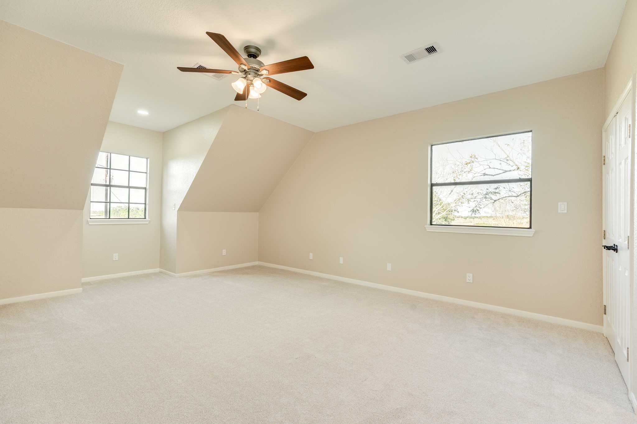 310 County Road 47 Angleton, TX 77515 - Photo 45 of 50 an empty room with windows and fan
