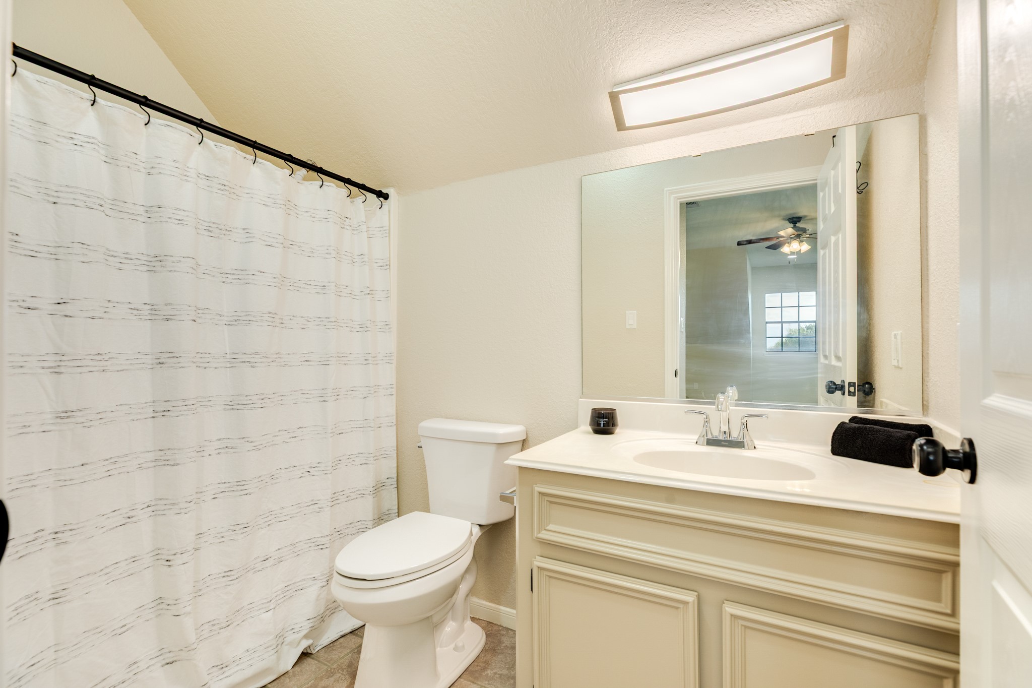 310 County Road 47 Angleton, TX 77515 - Photo 46 of 50 a bathroom with a sink a toilet and a mirror