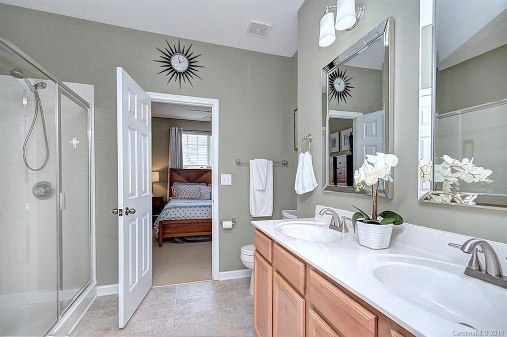 270 River Clay Road Fort Mill, SC 29708 - Photo 14 of 32 a en suite bathroom with a shower sink and mirror