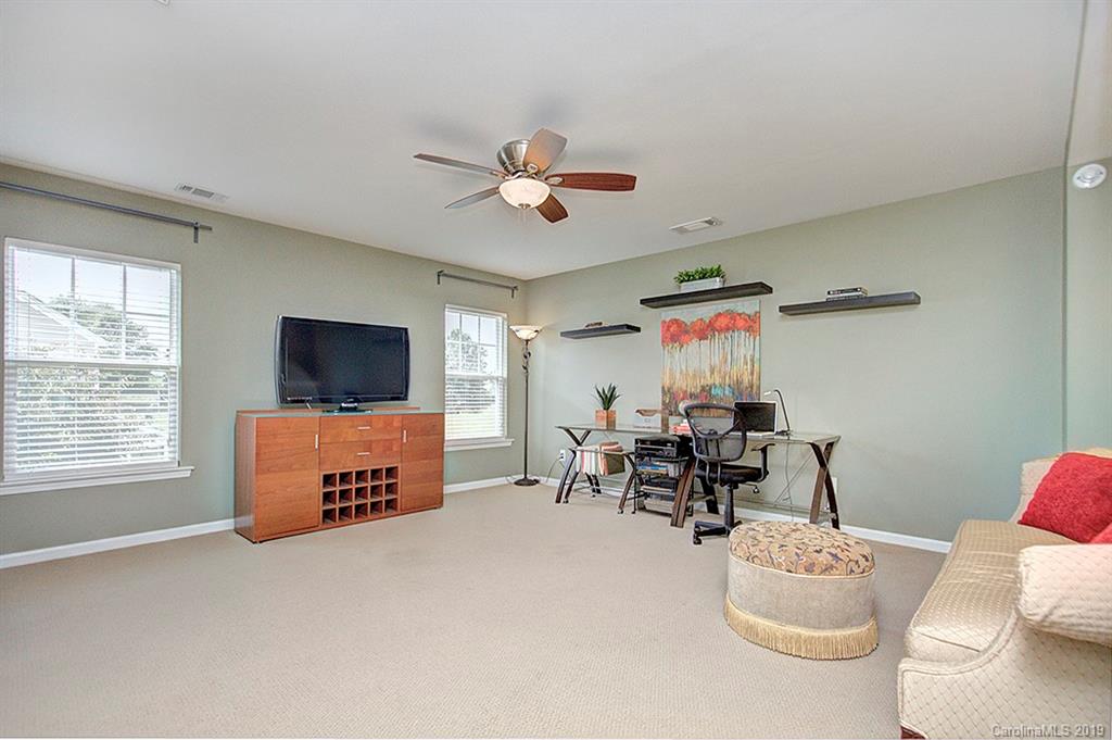 270 River Clay Road Fort Mill, SC 29708 - Photo 22 of 32 a living room with furniture and a flat screen tv
