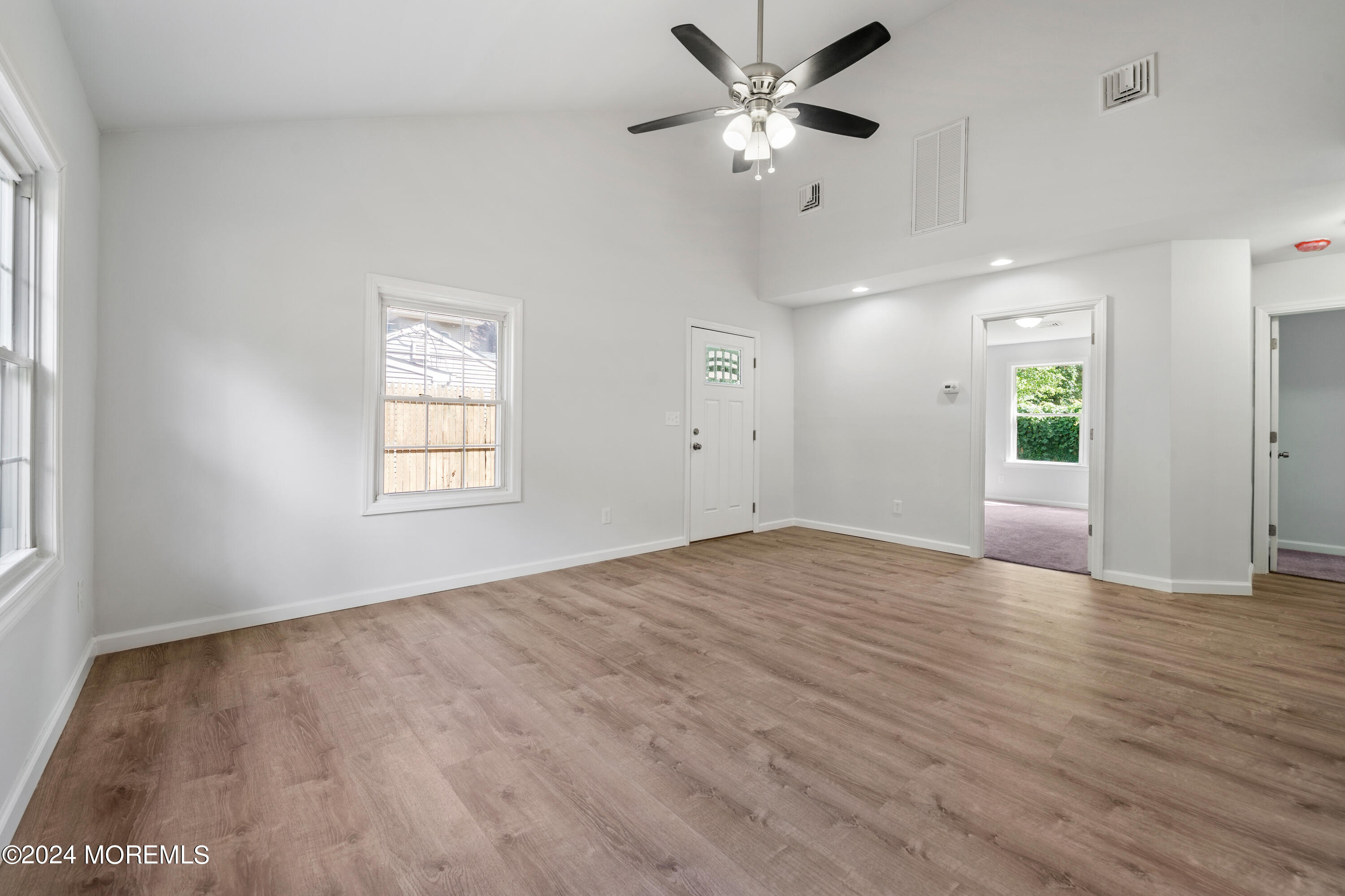 50 Dock Avenue Waretown, NJ 08758 - Photo 12 of 19 wooden floor in an empty room with a window