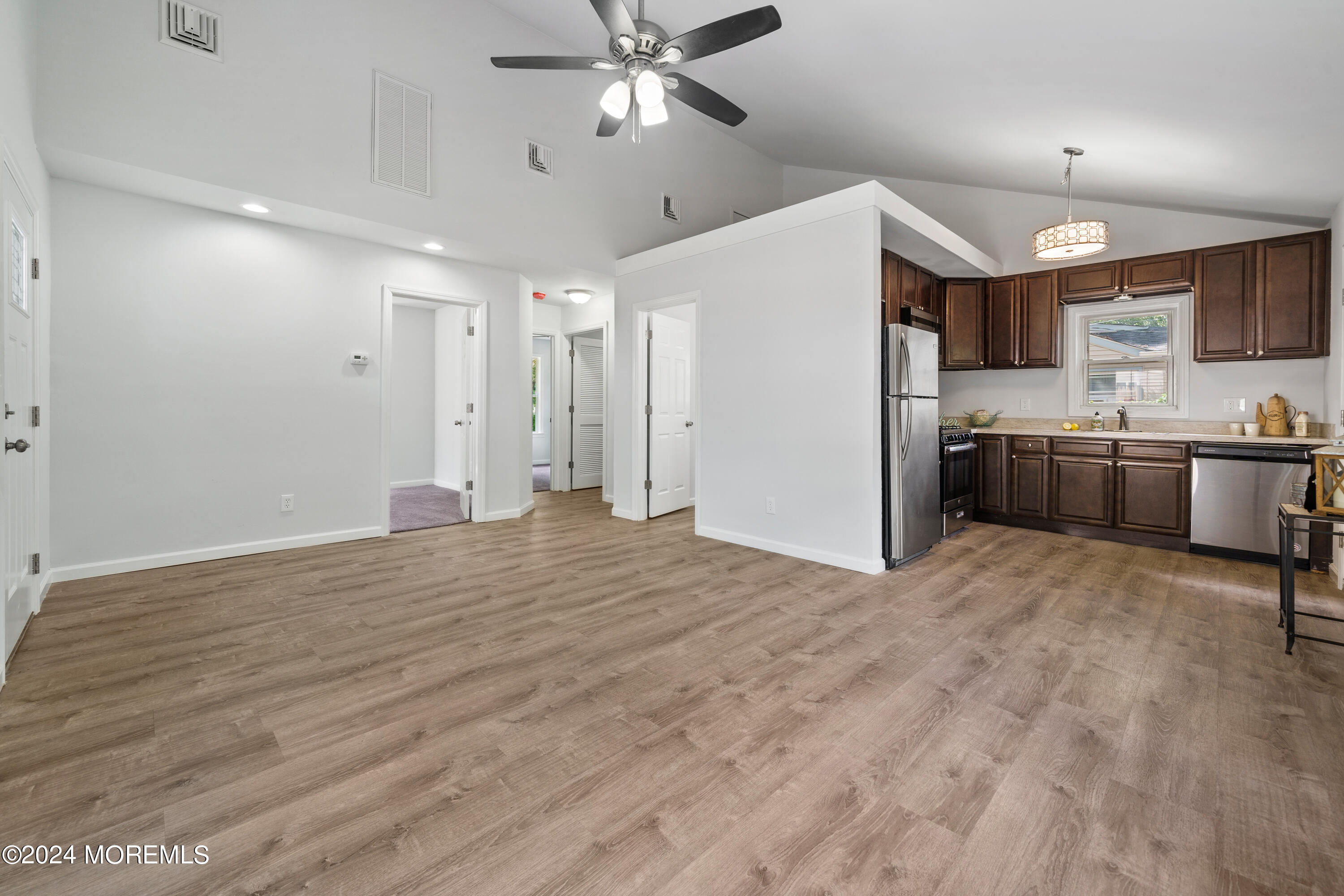 50 Dock Avenue Waretown, NJ 08758 - Photo 13 of 19 a open kitchen with stainless steel appliances granite countertop a refrigerator and a sink