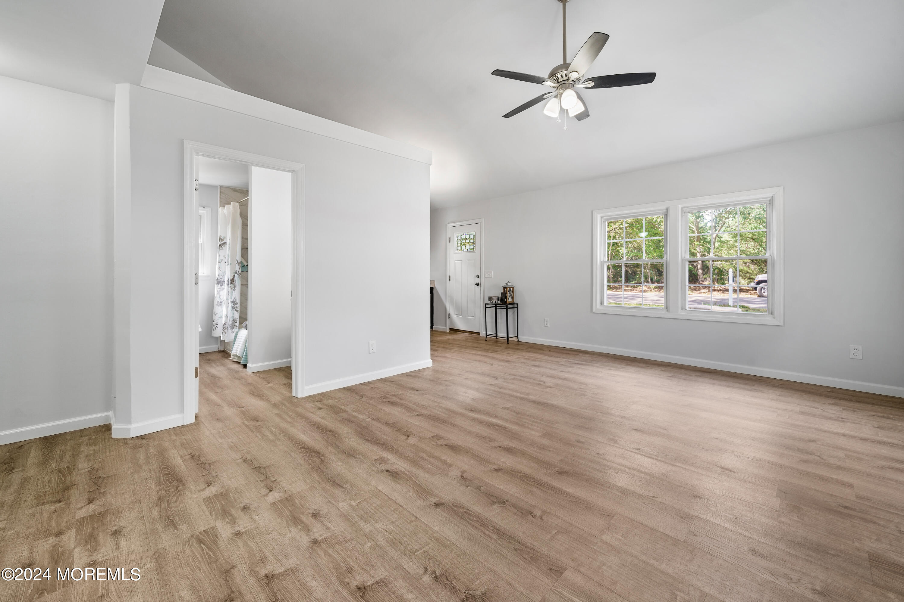 50 Dock Avenue Waretown, NJ 08758 - Photo 14 of 19 an empty room with fan and windows