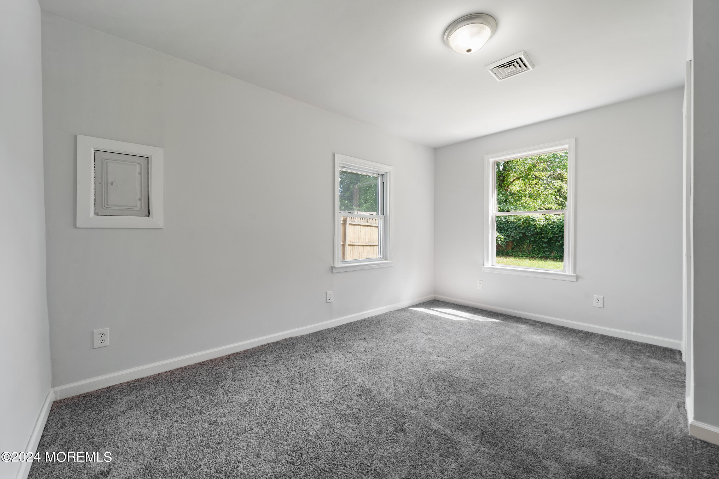 50 Dock Avenue Waretown, NJ 08758 - Photo 16 of 19 an empty room with windows