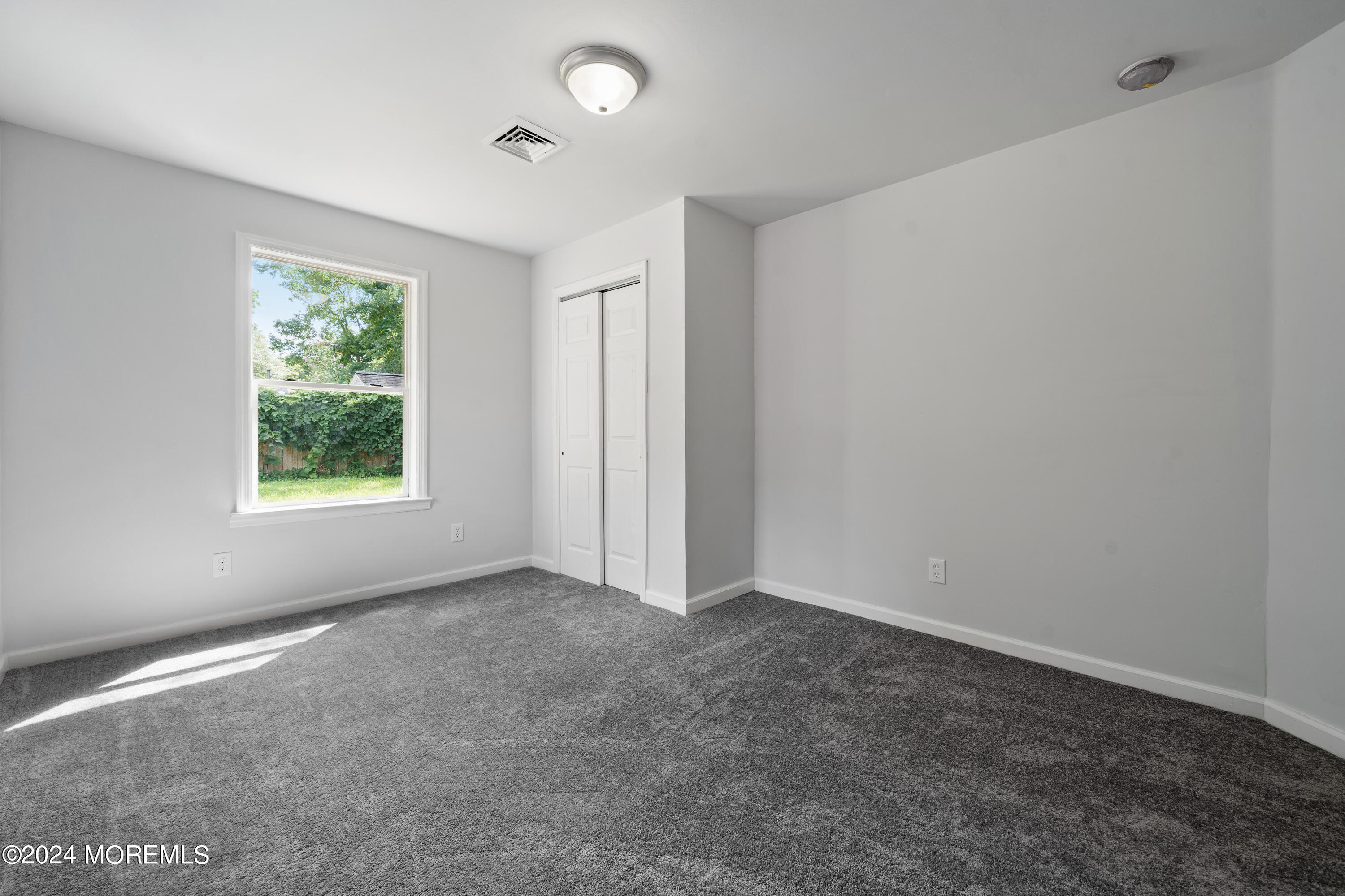 50 Dock Avenue Waretown, NJ 08758 - Photo 17 of 19 an empty room with windows