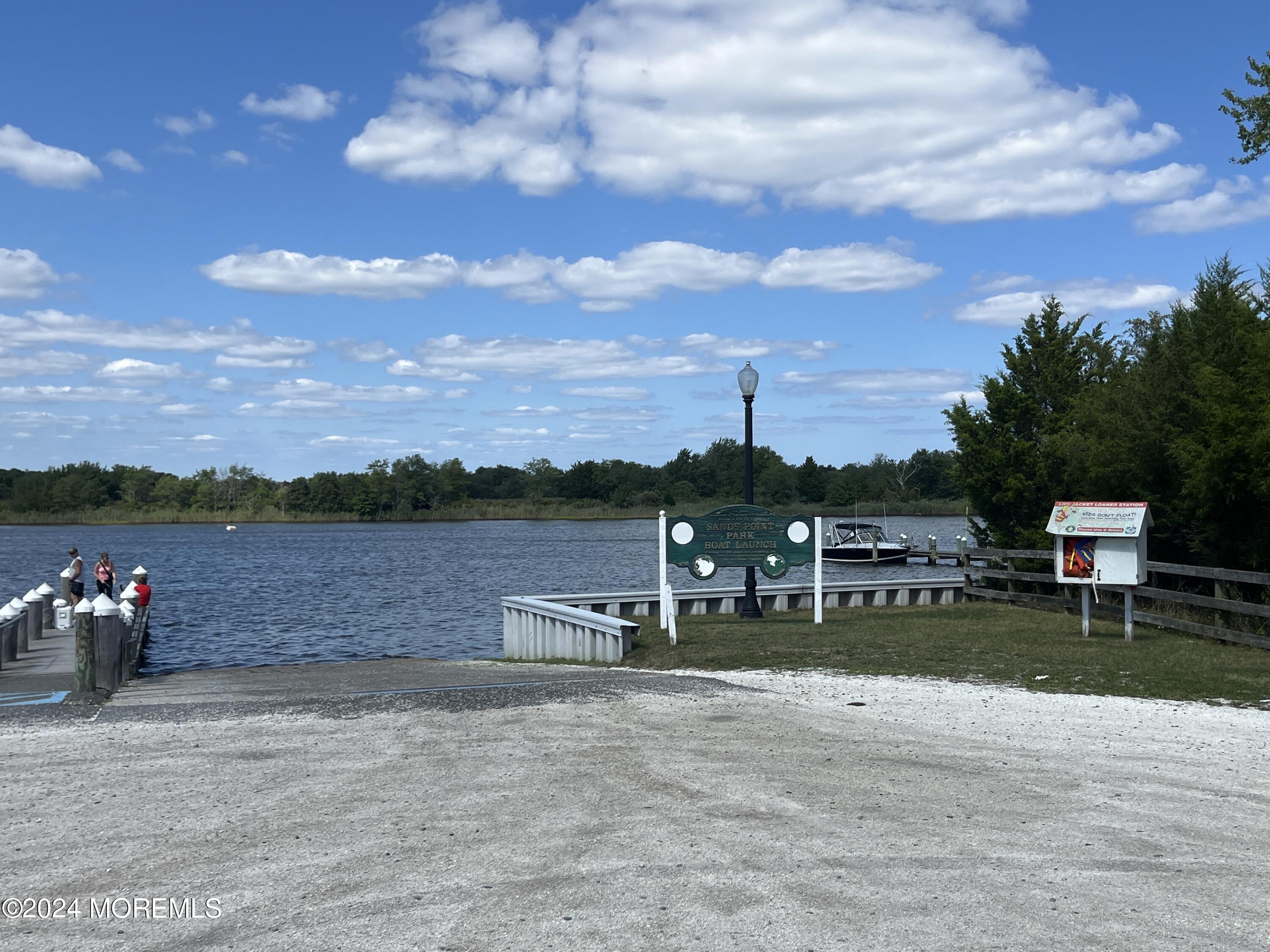 50 Dock Avenue Waretown, NJ 08758 - Photo 2 of 19 a view of a lake with a sitting space
