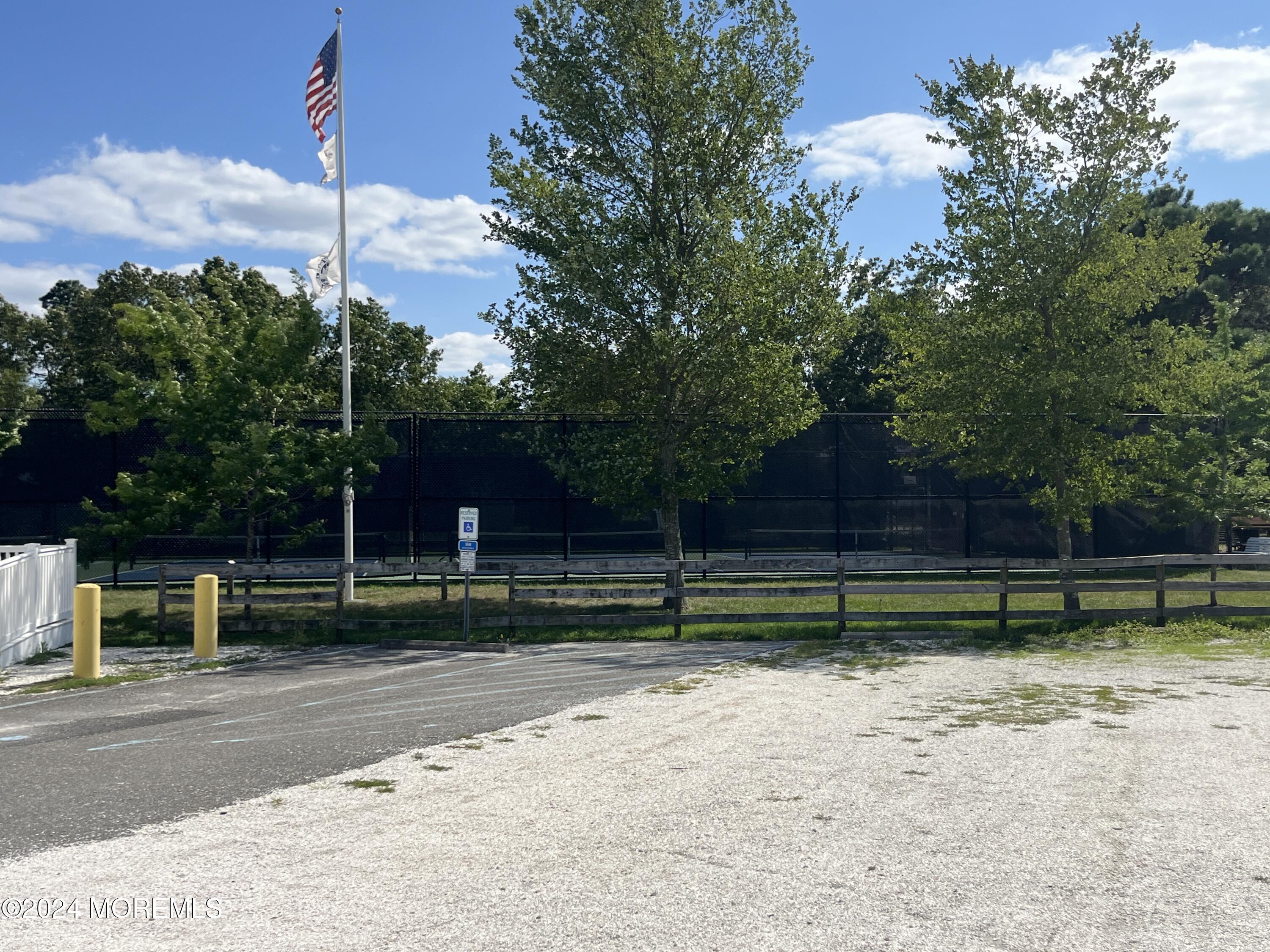 50 Dock Avenue Waretown, NJ 08758 - Photo 5 of 19 a green field with lots of trees in the background