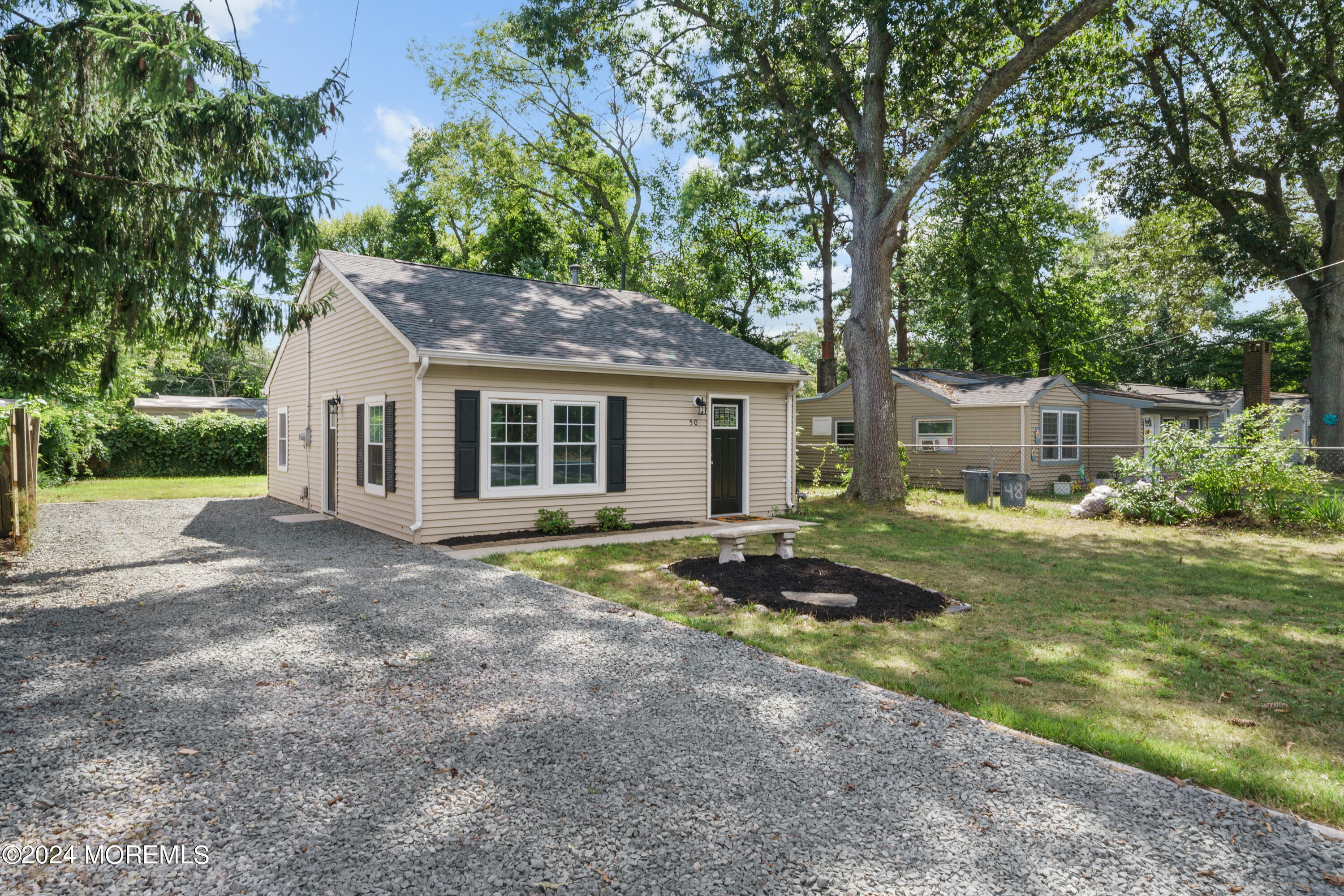 50 Dock Avenue Waretown, NJ 08758 - Photo 6 of 19 a view of a house with backyard and garden