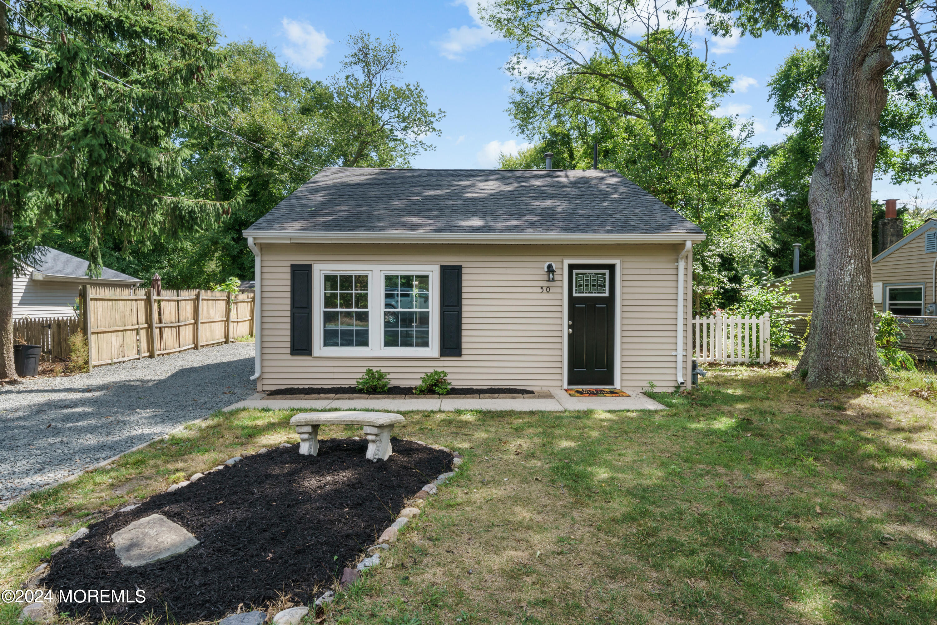 50 Dock Avenue Waretown, NJ 08758 - Photo 7 of 19 a house view with a garden space
