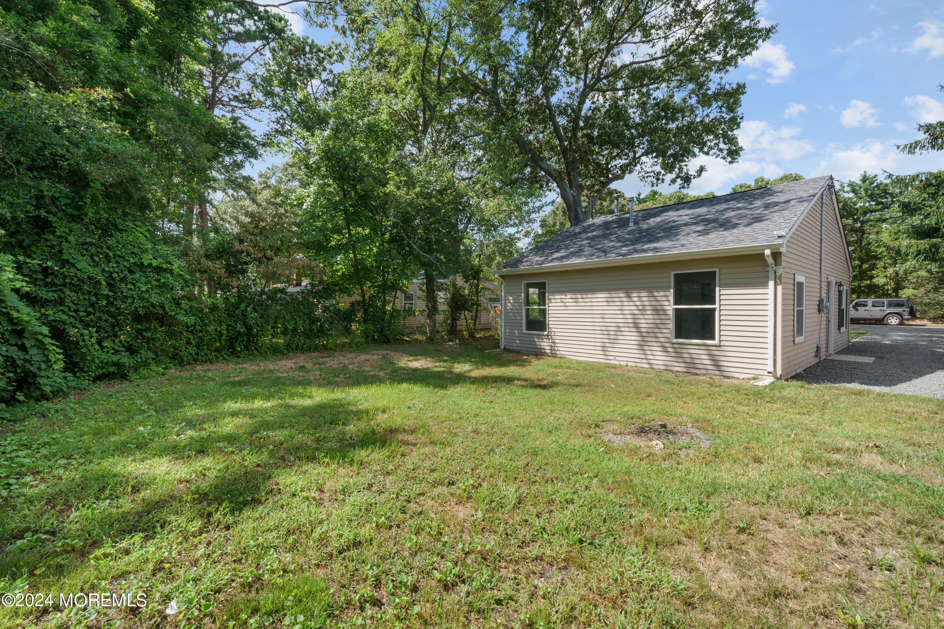 50 Dock Avenue Waretown, NJ 08758 - Photo 8 of 19 a view of a backyard with a garden