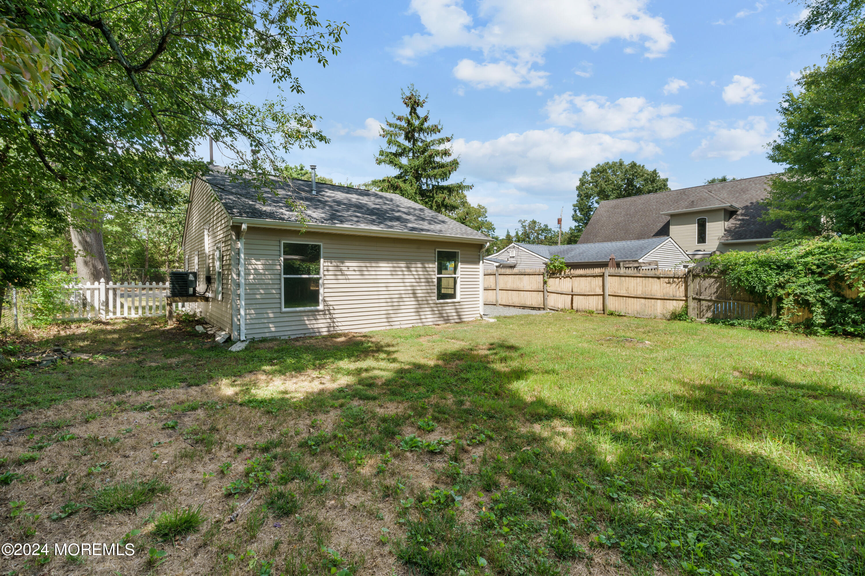 50 Dock Avenue Waretown, NJ 08758 - Photo 9 of 19 a view of a house with a backyard