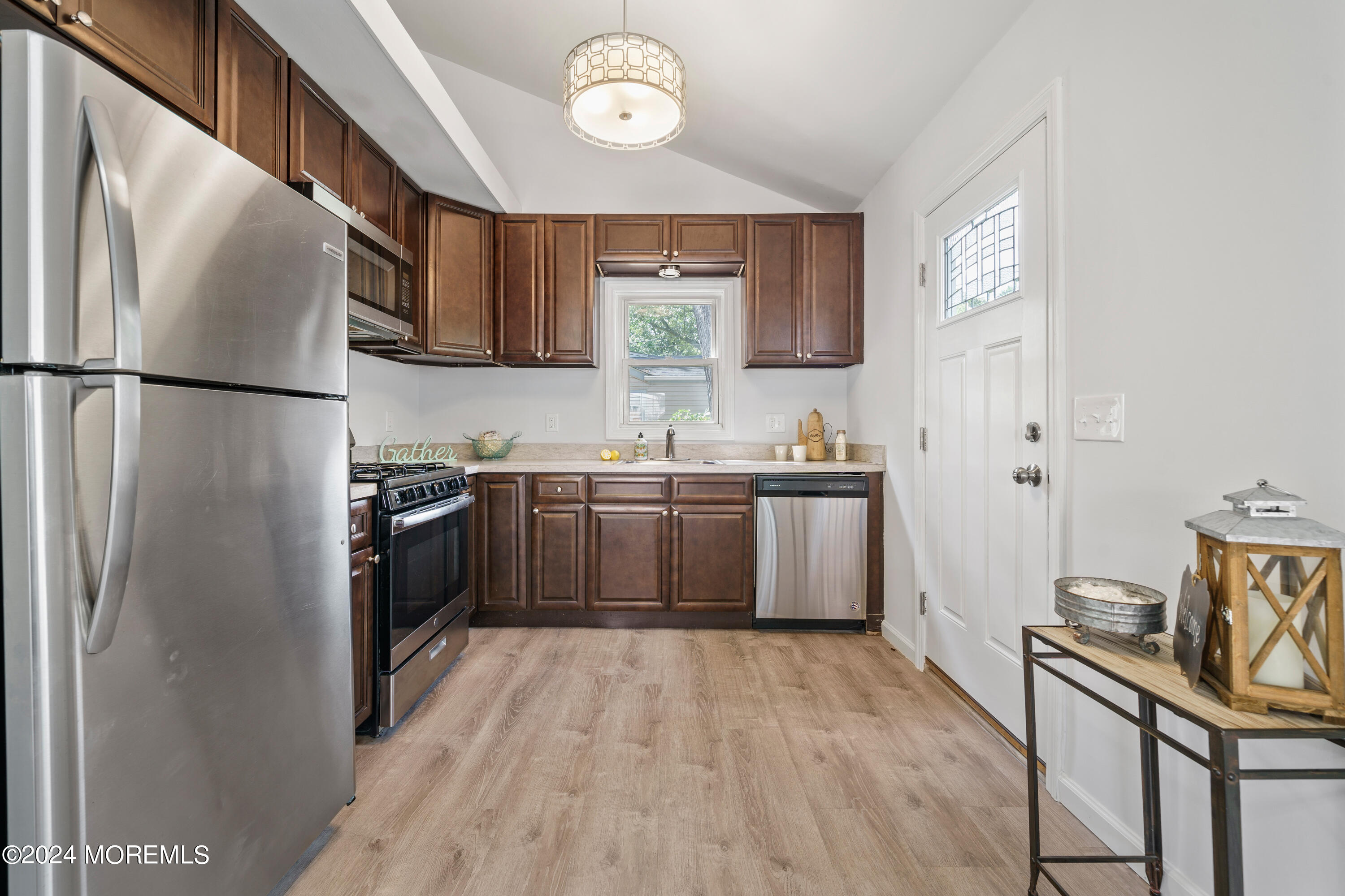 50 Dock Avenue Waretown, NJ 08758 - Photo 10 of 19 a kitchen with stainless steel appliances a sink cabinets and a refrigerator