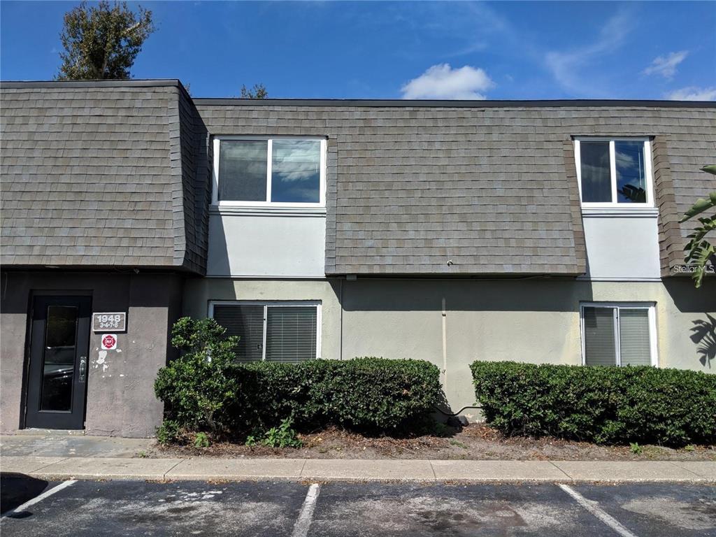 1948 South Conway Road, Unit 7 Orlando, FL 32812 - Photo 1 of 1 front view of a house with a street