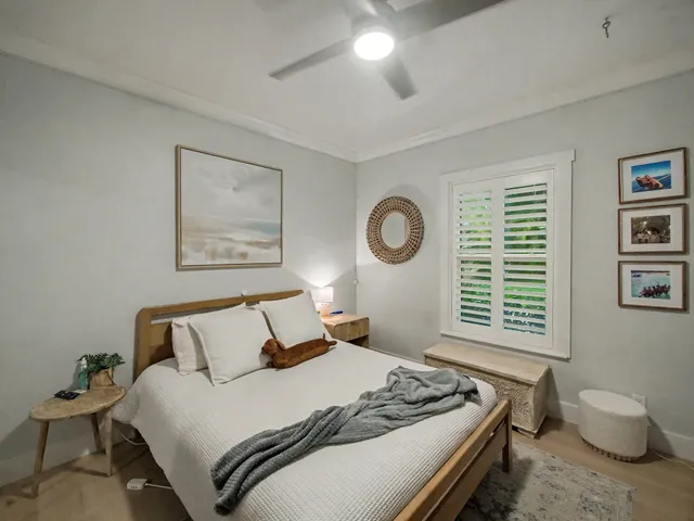 a bedroom with a bed and window