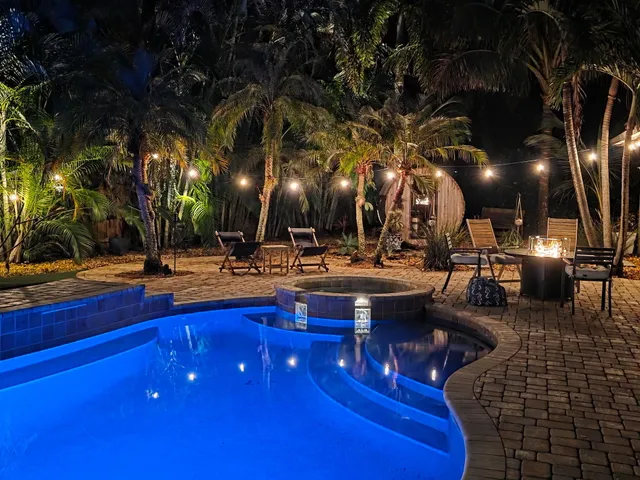 a view of swimming pool with outdoor seating