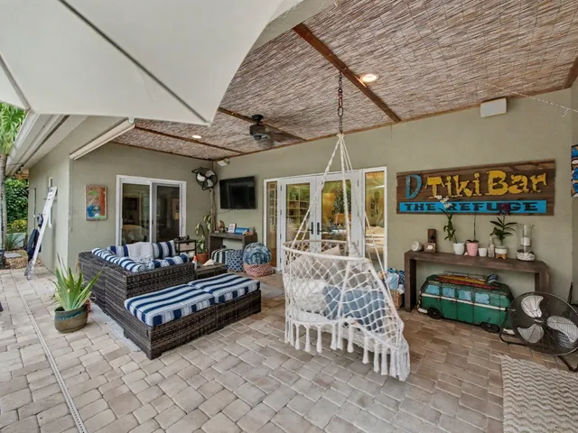 a outdoor living space with furniture and a fireplace