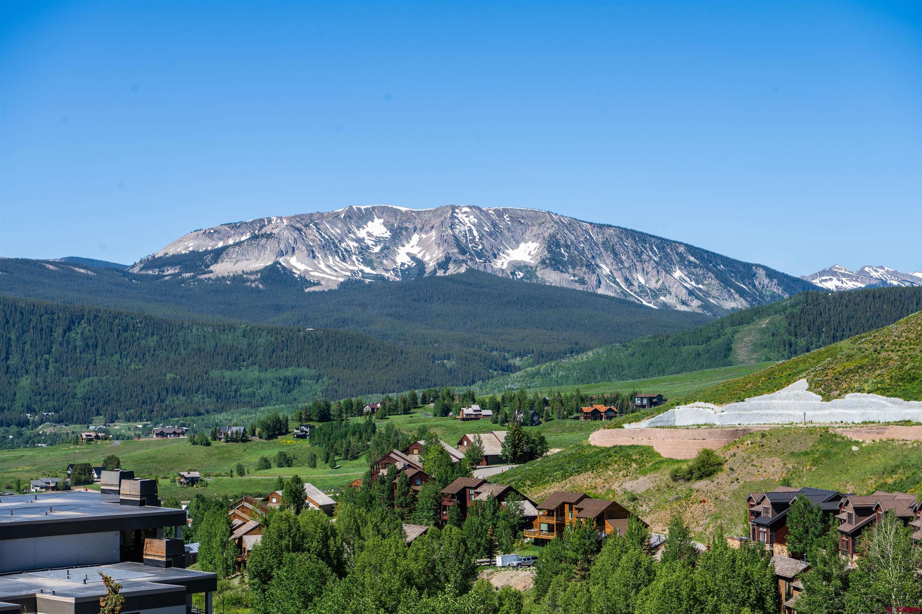 500 Gothic Road, Unit 542 Crested Butte, CO 81225 - Photo 21 of 22 a view of a lake with a mountain in the background