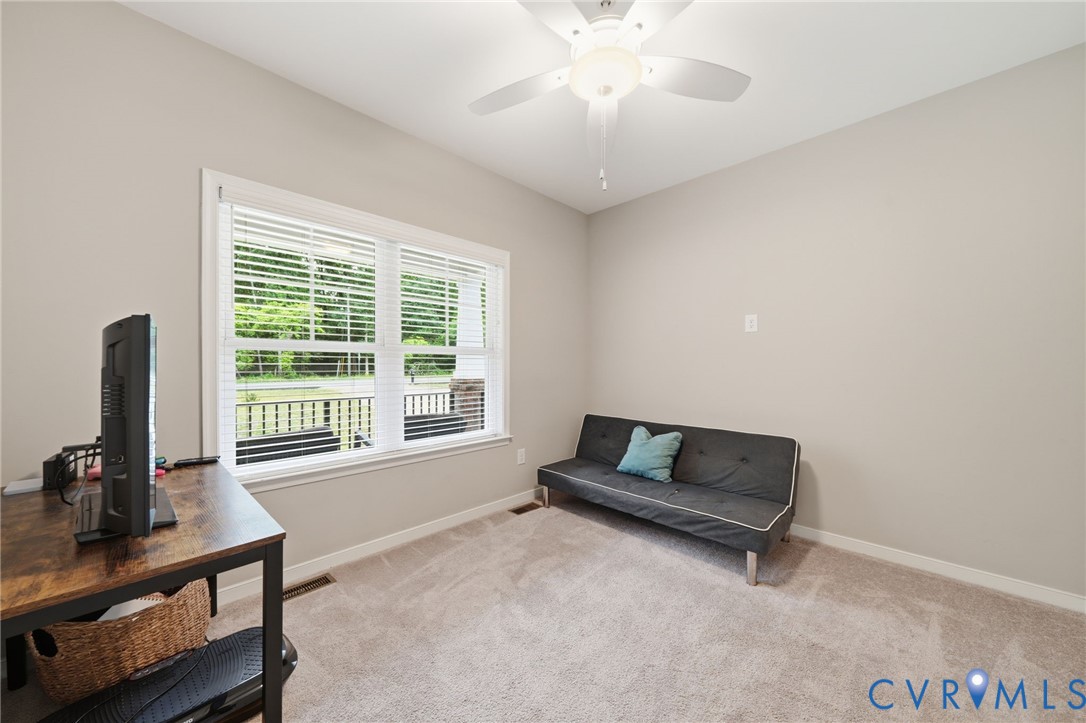 7598 Rural Point Road Mechanicsville, VA 23116 - Photo 19 of 41 a living room with furniture and a flat screen tv