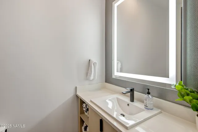 a view of a dining room with furniture and a flat screen tv