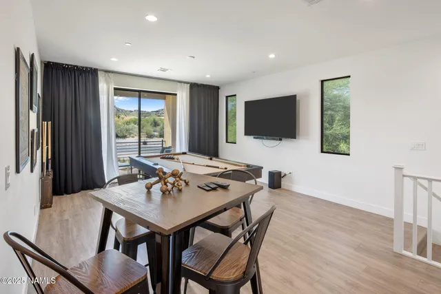 a bedroom with furniture and a window