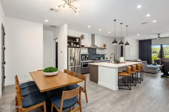 a living room with furniture fireplace and a flat screen tv
