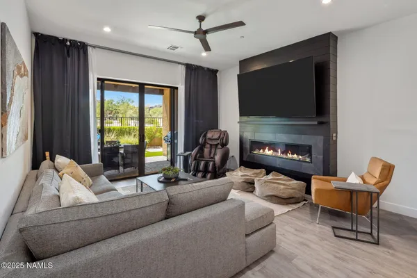 a bedroom with two beds and a flat screen tv